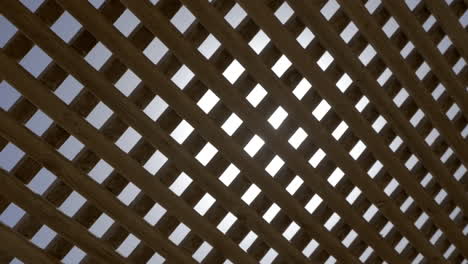 Bright-sun-shining-through-the-wooden-net-shed
