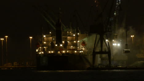 Unloading-cargo-ship-at-night-2