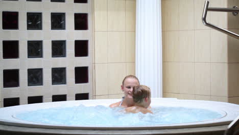 Mother-enjoying-a-spa-bath-with-her-son