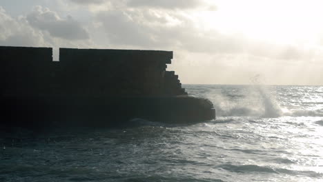 Ancient-stone-wall-and-wavy-sea-Acre-Israel