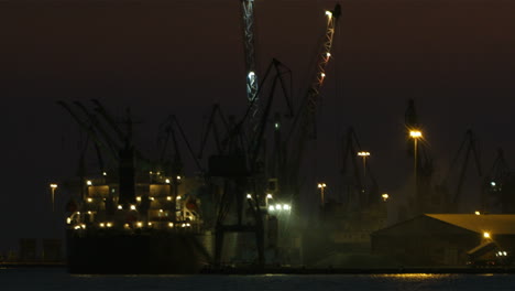 Unloading-cargo-ship-at-night-1