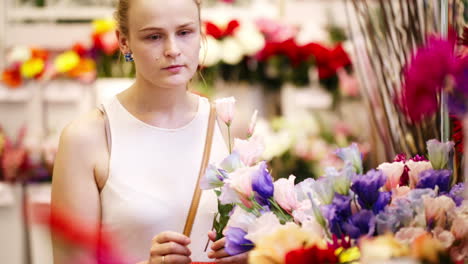 Beautiful-young-lady-buying-fresh-flowers