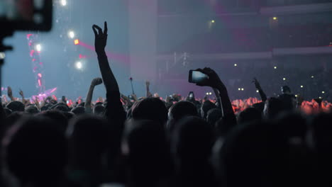 Crowd-of-young-music-fans-dancing-at-the-concert