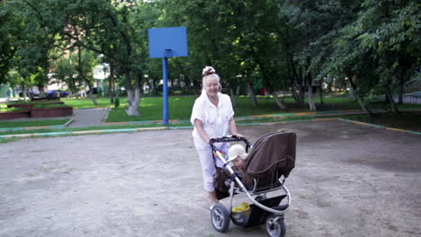 Grandmother-walks-with-her-grandson-in-the-yard