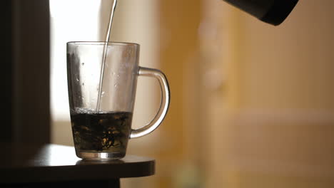 Pouring-a-mug-of-herbal-tea