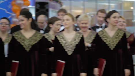 People-enjoying-choir-performance-and-applauding