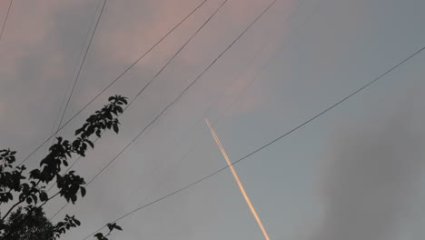 Plane-with-white-trail-in-the-sky