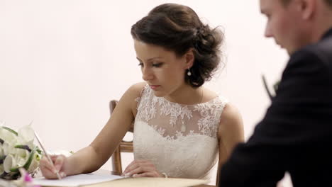 Bride-signing-marriage-license
