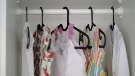 Baby-girl-clothes-in-wardrobe