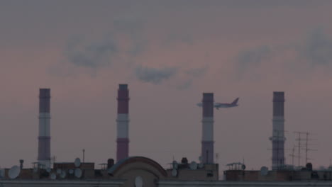 Industrial-view-with-chimneys-and-airplane
