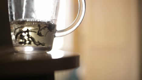 Pouring-a-mug-of-herbal-tea