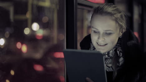 Woman-with-touchpad-in-the-bus