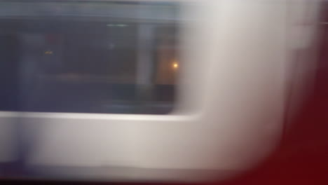 High-speed-passenger-train-whooshing-by-blurry-motion