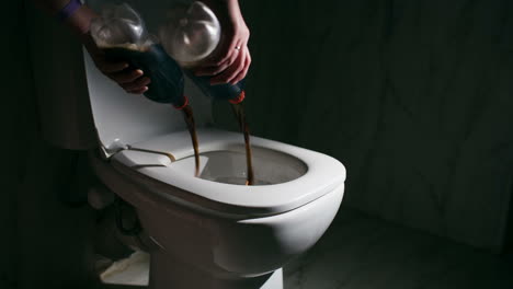 Pouring-out-cola-into-the-toilet