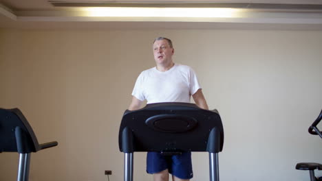 Middle-aged-man-working-out-on-a-treadmill