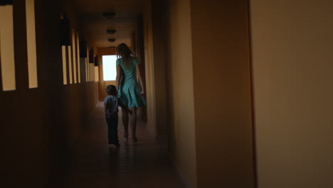 Mother-and-son-in-hotel-hall