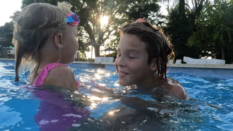Brother-and-sister-playing-in-the-pool