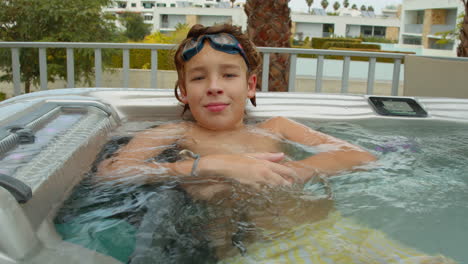 Teen-enjoying-villa-hot-tub