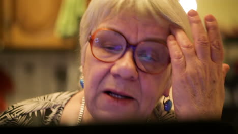 Modern-elderly-woman-using-skype
