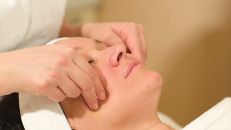 Seance-of-professional-facial-massage-at-beauty-spa