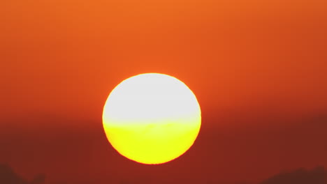 Red-hot-sky-with-sun-disk-rising