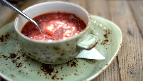 Borsch-with-sour-cream-served-in-cafe