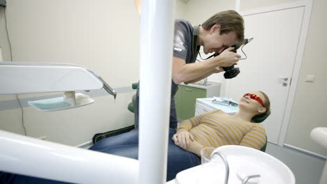 Dentist-taking-pictures-of-womans-smile