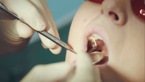 Dentist-providing-examination-of-a-woman