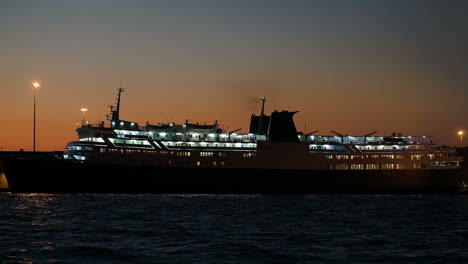 Illuminated-cruise-ship-in-late-evening