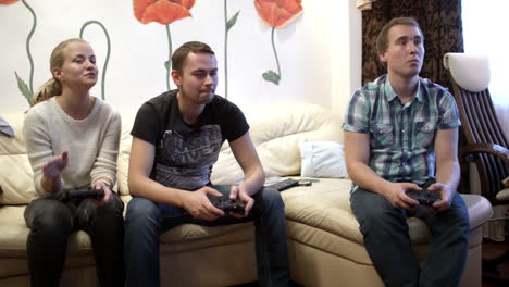 Two-men-and-girl-playing-video-game