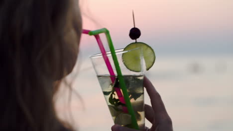Woman-drinking-mojito-with-a-straw