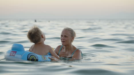 Mother-and-son-having-fun-playing-in-the-sea