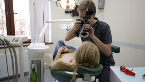 Dentist-making-shots-of-womans-smile-after-treatment