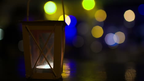 Outdoor-lantern-with-lit-candle