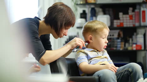 Little-boy-during-haircut-at-the-hairdressing-saloon