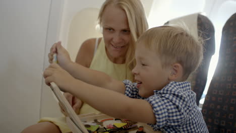 Mother-and-son-playing-game-in-the-plane