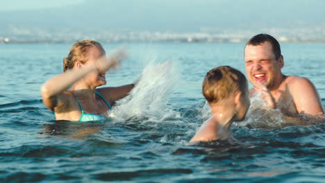 Happy-family-having-fun-in-sea-water