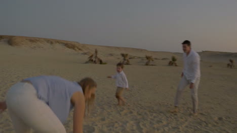 Active-game-with-child-on-the-beach-at-sunset
