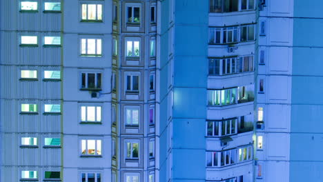 Timelapse-of-multistorey-building-with-twilnkling-lights-in-late-evening