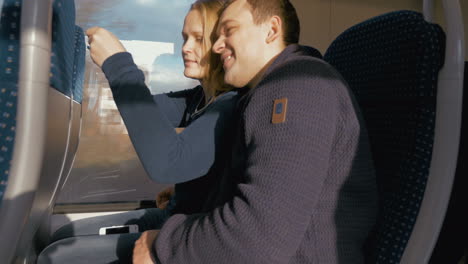 Timelapse-of-couple-making-selfie-with-pad-in-train
