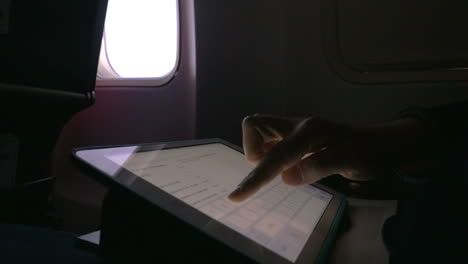 Chatting-on-pad-in-the-airplane