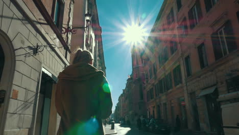Woman-walking-along-the-street-in-Rome