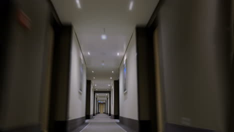 Timelapse-of-moving-forward-in-empty-light-hotel-corridor