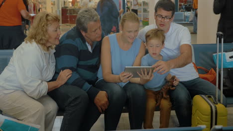 Big-Family-with-Tablet-in-Waiting-Room