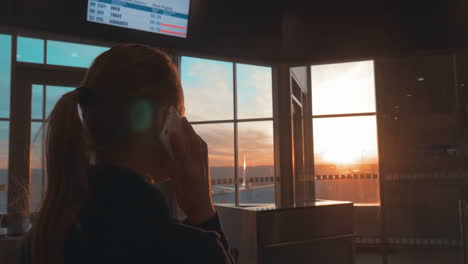 Woman-having-a-phone-talk-at-the-airport