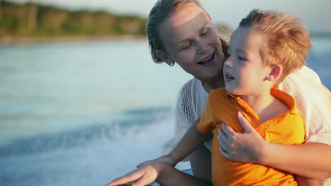 Mother-and-son-enjoying-sea-travel-by-boat