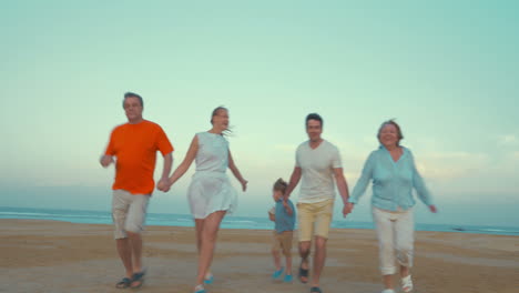 Bih-happy-family-running-on-the-beach