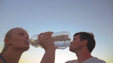 Couple-Drinking-Water-after-Exercises