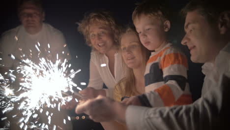Mother-and-son-with-sparklers-at-night