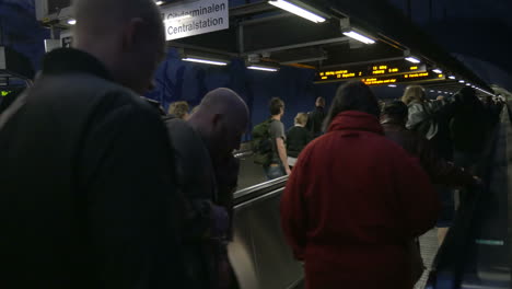Crowd-of-people-on-flat-escalators-in-subway
